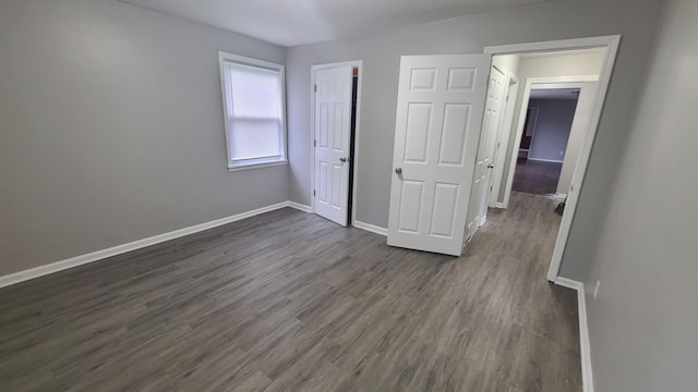 16002 Spaulding Ave, Markham, IL 60428 - unfurnished bedroom with dark wood-type flooring and a closet