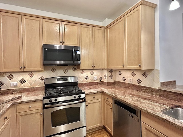 8449 Callie Ave, Morton Grove, IL 60053 - kitchen with appliances with stainless steel finishes, light brown cabinetry, stone counters, and tasteful backsplash