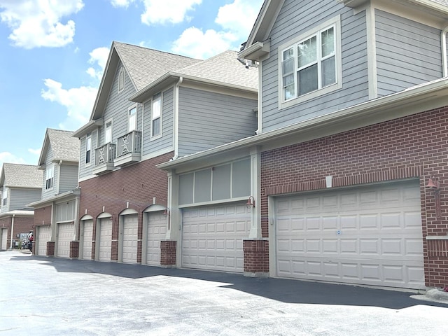 8449 Callie Ave, Morton Grove, IL 60053 - view of side of property featuring brick siding and roof with shingles