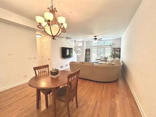 8449 Callie Ave, Morton Grove, IL 60053 - dining area featuring light wood-style floors, a ceiling fan, and a chandelier