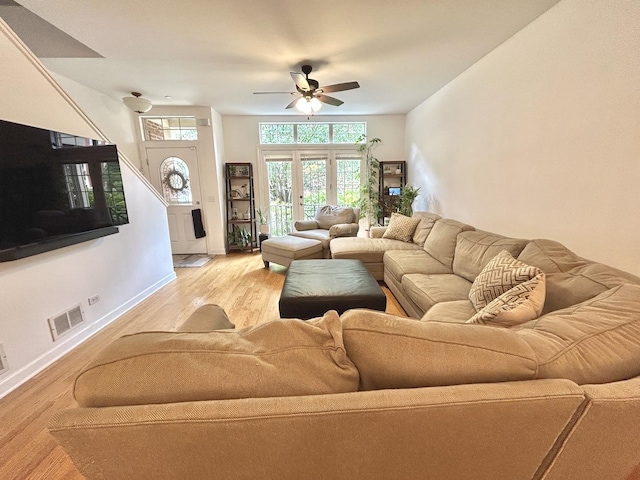 8449 Callie Ave, Morton Grove, IL 60053 - living room featuring light wood-style floors, ceiling fan, and french doors
