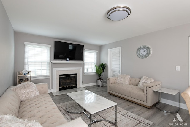 40 Jackson Ln, Streamwood, IL 60107 - living room featuring a tiled fireplace and wood finished floors