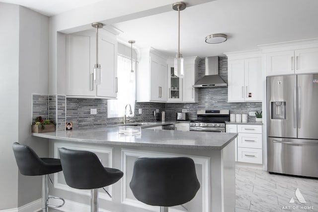40 Jackson Ln, Streamwood, IL 60107 - kitchen with appliances with stainless steel finishes, wall chimney exhaust hood, a peninsula, white cabinetry, and decorative backsplash