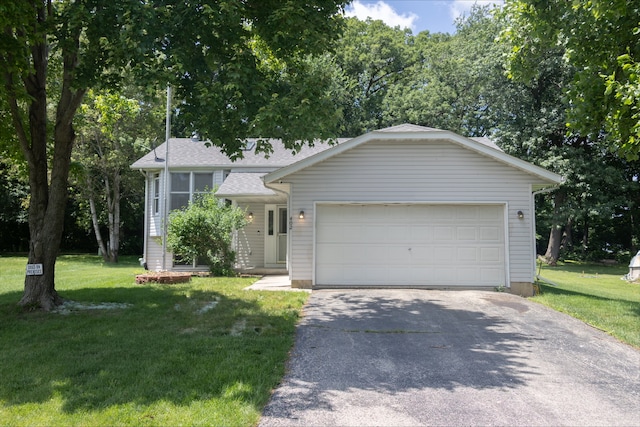 402 Staffordshire Dr, Poplar Grove, IL 61065 - view of front of house with asphalt driveway, a front lawn, and an attached garage