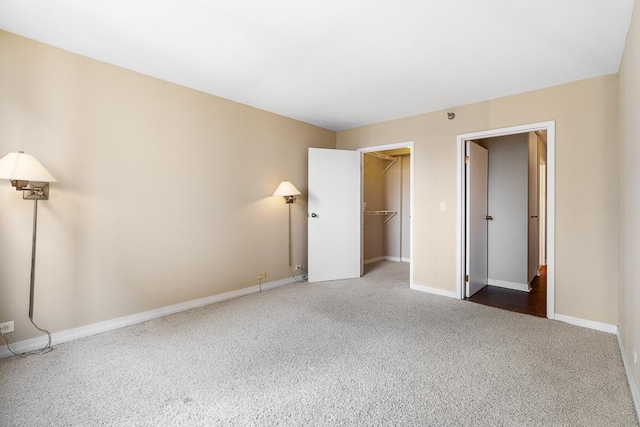 401 E Ontario St Unit 2804, Chicago, IL 60611 - unfurnished bedroom featuring carpet flooring, a walk in closet, and a closet