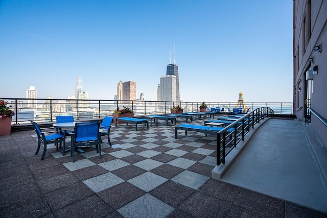 401 E Ontario St Unit 2804, Chicago, IL 60611 - view of patio featuring a skyline view and outdoor dining area