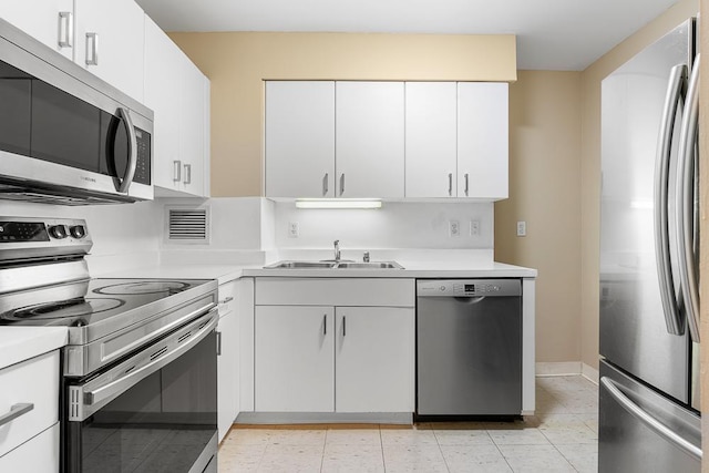 401 E Ontario St Unit 2804, Chicago, IL 60611 - kitchen with appliances with stainless steel finishes, light countertops, and white cabinetry