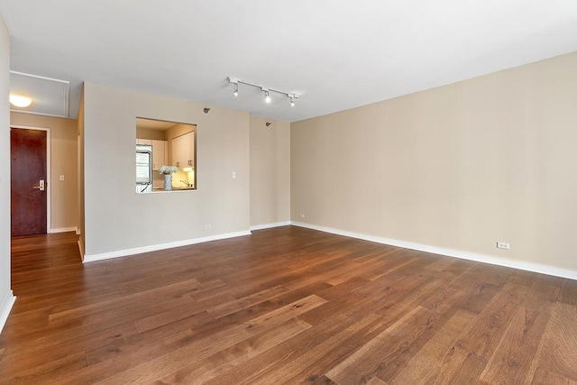 401 E Ontario St Unit 2804, Chicago, IL 60611 - empty room featuring dark wood-style floors and track lighting