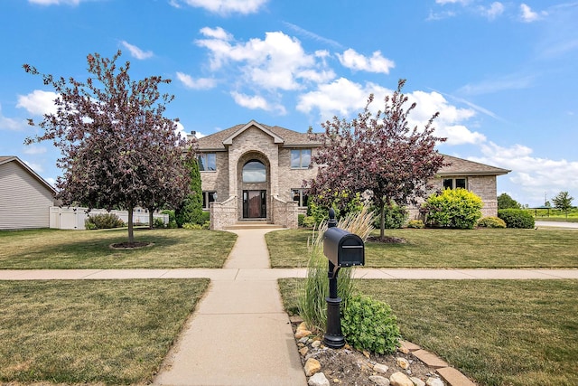 1920 Summerfield Ln, Bourbonnais, IL 60914 - view of front facade featuring a front lawn and brick siding