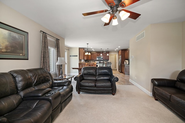 1920 Summerfield Ln, Bourbonnais, IL 60914 - living area featuring light colored carpet, a ceiling fan, recessed lighting, and a chandelier
