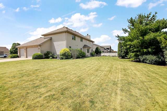 1920 Summerfield Ln, Bourbonnais, IL 60914 - view of home's exterior with an attached garage, concrete driveway, and a chimney