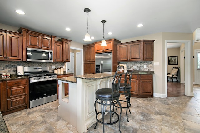 1920 Summerfield Ln, Bourbonnais, IL 60914 - kitchen with stainless steel appliances, tasteful backsplash, a breakfast bar area, a kitchen island, and dark stone countertops