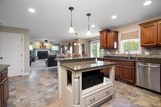1920 Summerfield Ln, Bourbonnais, IL 60914 - kitchen with dishwasher, decorative backsplash, a fireplace, brown cabinetry, and recessed lighting
