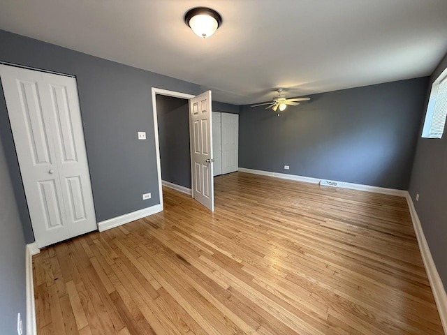 8809 S Harvard Ave, Chicago, IL 60620 - unfurnished bedroom with light wood-style flooring and a ceiling fan