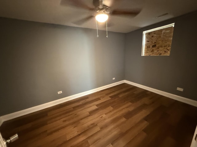 8809 S Harvard Ave, Chicago, IL 60620 - empty room with ceiling fan and dark wood-type flooring
