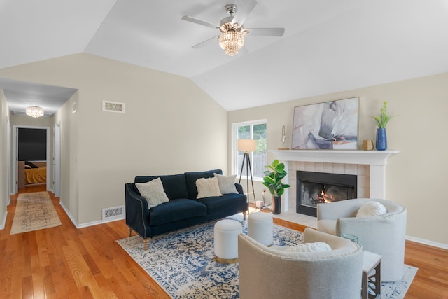 231 E Fullerton Ave, Glendale Heights, IL 60139 - living room featuring ceiling fan, wood finished floors, vaulted ceiling, and a fireplace