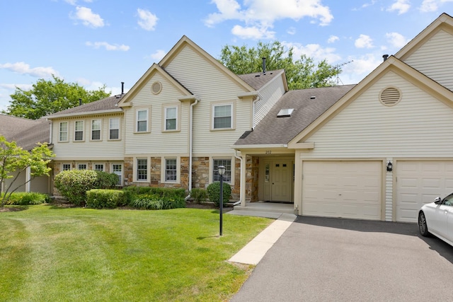 202 Dublin Ln Unit V-1, Schaumburg, IL 60194 - view of front of property with a garage, roof with shingles, a front yard, driveway, and stone siding