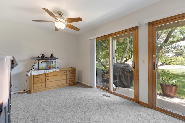 202 Dublin Ln Unit V-1, Schaumburg, IL 60194 - bedroom featuring access to exterior, carpet floors, and a ceiling fan