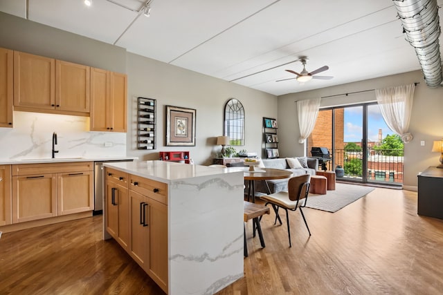 3125 W Fullerton Ave Unit 508, Chicago, IL 60647 - kitchen with open floor plan, dishwasher, wood finished floors, and light brown cabinets