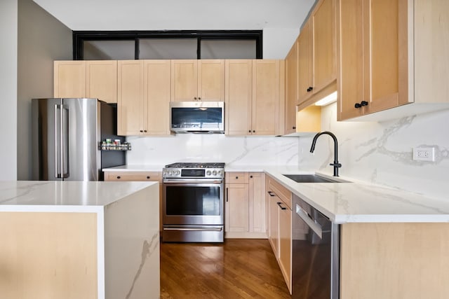 3125 W Fullerton Ave Unit 508, Chicago, IL 60647 - kitchen with stainless steel appliances, light brown cabinetry, dark wood-type flooring, decorative backsplash, and light stone countertops