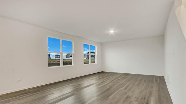 11371 Wildridge Ln, Huntley, IL 60142 - empty room with wood finished floors and baseboards