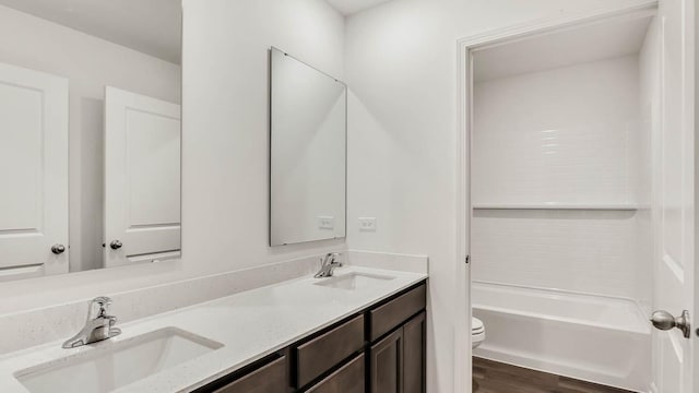 11371 Wildridge Ln, Huntley, IL 60142 - bathroom with double vanity, wood finished floors, and shower / tub combination