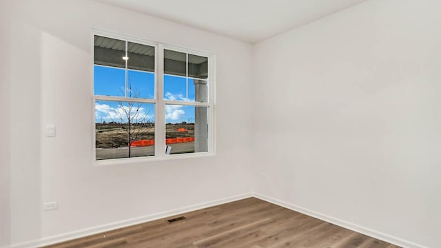 11371 Wildridge Ln, Huntley, IL 60142 - unfurnished room featuring wood finished floors and baseboards