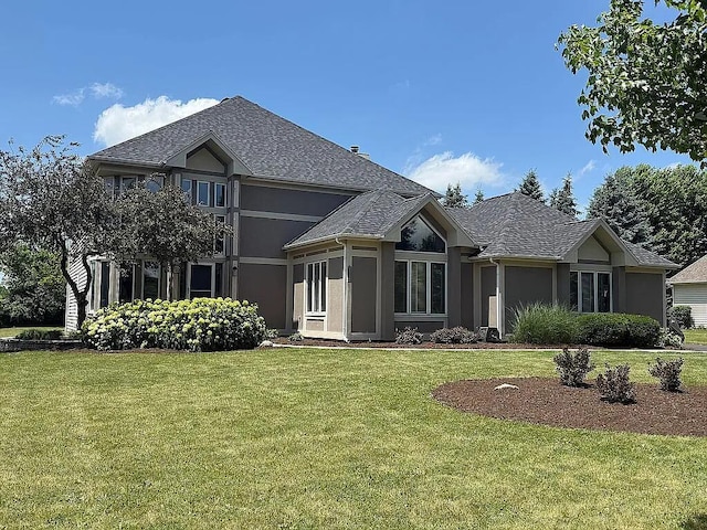 06N274 W Ridgewood Ln, Saint Charles, IL 60175 - rear view of property with stucco siding, a yard, and a shingled roof