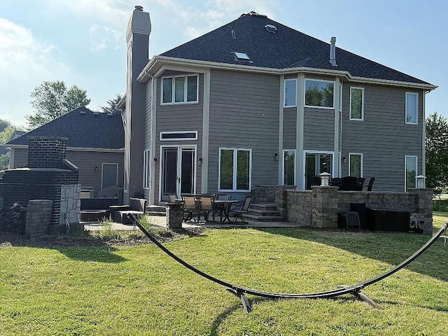06N274 W Ridgewood Ln, Saint Charles, IL 60175 - back of house featuring a chimney, a yard, and a patio