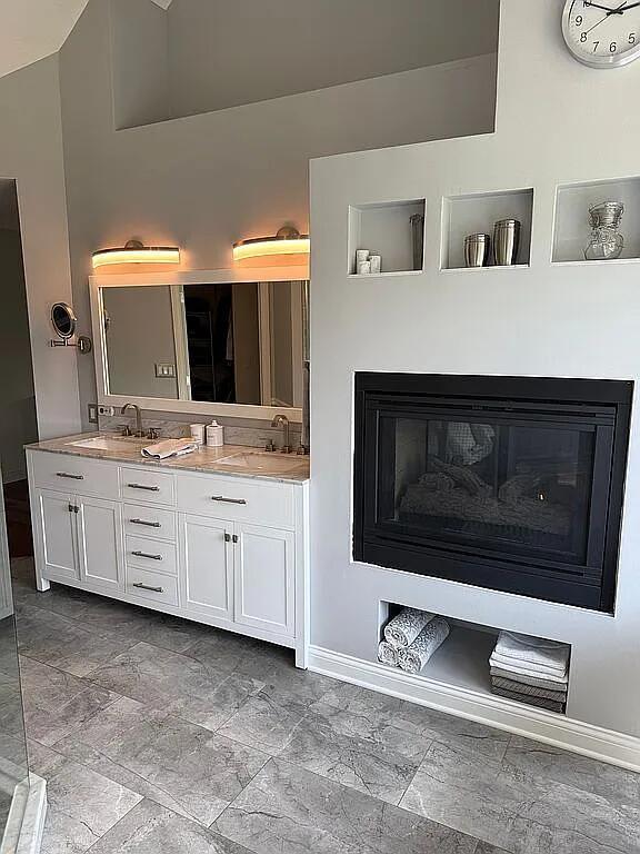 06N274 W Ridgewood Ln, Saint Charles, IL 60175 - bathroom featuring double vanity and a glass covered fireplace