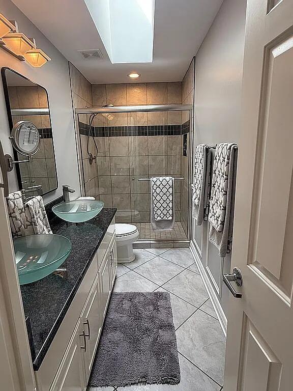 06N274 W Ridgewood Ln, Saint Charles, IL 60175 - full bathroom featuring tile patterned floors, double vanity, and a stall shower