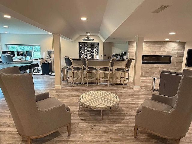06N274 W Ridgewood Ln, Saint Charles, IL 60175 - indoor dry bar featuring wood finished floors, decorative columns, and recessed lighting