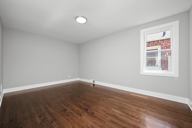 8051 S Paxton Ave, Chicago, IL 60617 - spare room featuring dark wood-style floors