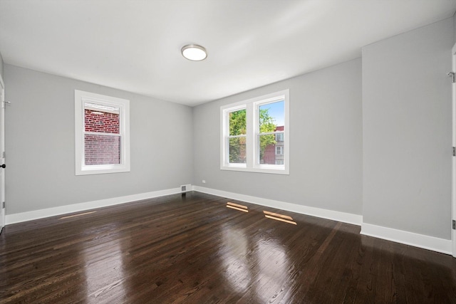 8051 S Paxton Ave, Chicago, IL 60617 - spare room featuring dark wood-type flooring