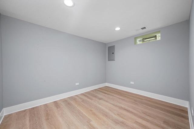 8051 S Paxton Ave, Chicago, IL 60617 - empty room featuring electric panel, wood finished floors, and recessed lighting
