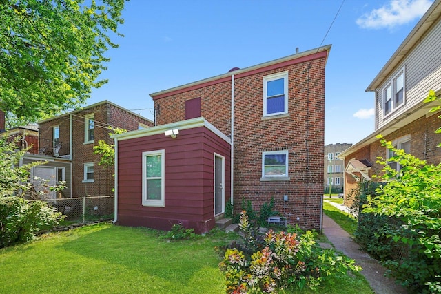 8051 S Paxton Ave, Chicago, IL 60617 - rear view of property with brick siding and entry steps