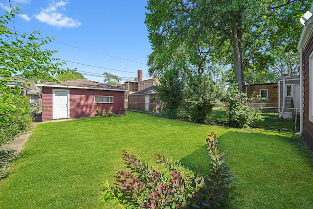 8051 S Paxton Ave, Chicago, IL 60617 - fenced backyard with an outdoor structure