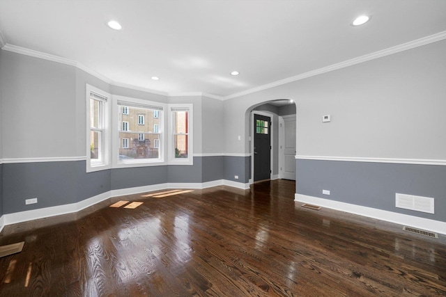 8051 S Paxton Ave, Chicago, IL 60617 - spare room featuring arched walkways, recessed lighting, wood finished floors, and crown molding