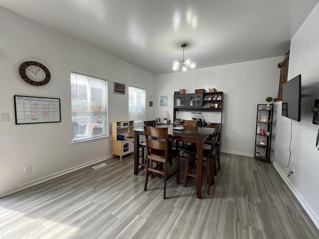 14143 S Napa Cir, Plainfield, IL 60544 - dining room featuring wood finished floors and a chandelier