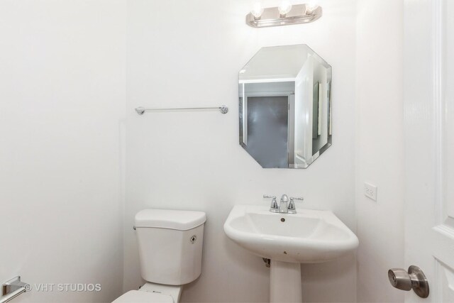 1110 Oakhill Dr, Aurora, IL 60502 - half bathroom with toilet and a sink