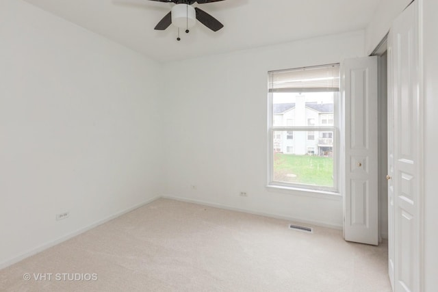 1110 Oakhill Dr, Aurora, IL 60502 - empty room featuring light colored carpet and ceiling fan