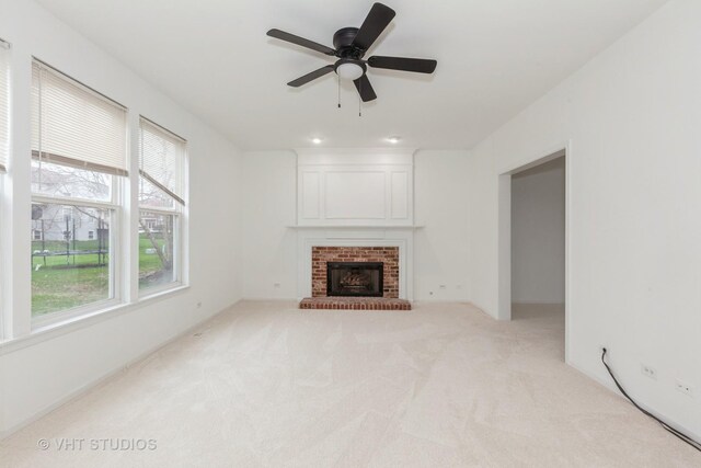 1110 Oakhill Dr, Aurora, IL 60502 - unfurnished living room featuring carpet, a brick fireplace, and ceiling fan