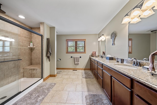 10732 Revere Rd, Mokena, IL 60448 - bathroom featuring double vanity, a shower stall, and tile patterned flooring