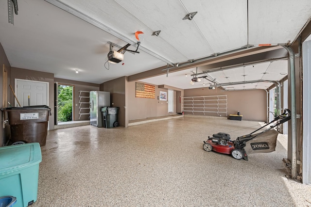 10732 Revere Rd, Mokena, IL 60448 - garage with stainless steel refrigerator with ice dispenser and a garage door opener