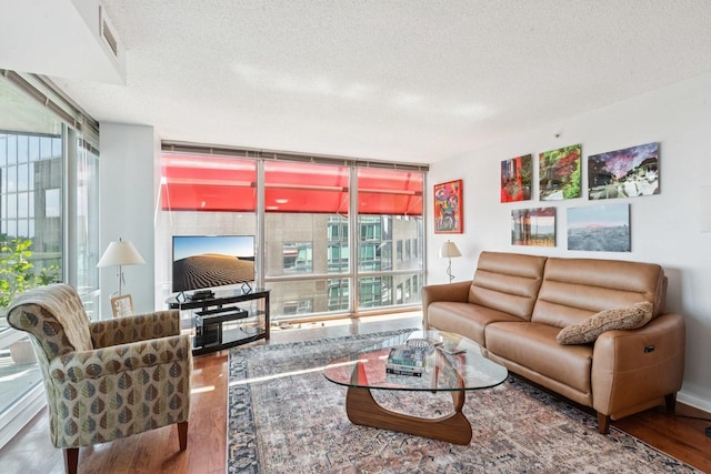800 Elgin Rd Unit 1017, Evanston, IL 60201 - living area with wood finished floors, healthy amount of natural light, a textured ceiling, and floor to ceiling windows