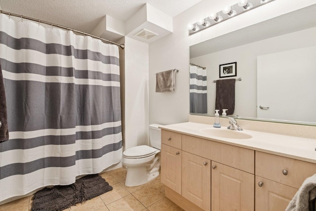 800 Elgin Rd Unit 1017, Evanston, IL 60201 - full bathroom with vanity, tile patterned floors, a shower with shower curtain, and a textured ceiling