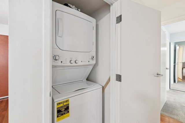 800 Elgin Rd Unit 1017, Evanston, IL 60201 - laundry area featuring stacked washer / dryer and wood finished floors