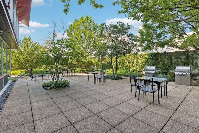 800 Elgin Rd Unit 1017, Evanston, IL 60201 - view of patio featuring outdoor dining space and a grill