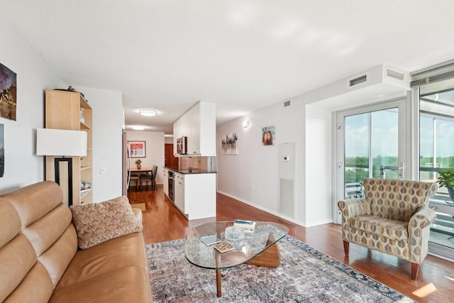800 Elgin Rd Unit 1017, Evanston, IL 60201 - living area featuring dark wood-style floors