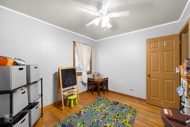 7314 W 113th Pl, Worth, IL 60482 - game room with a ceiling fan, wood finished floors, and crown molding